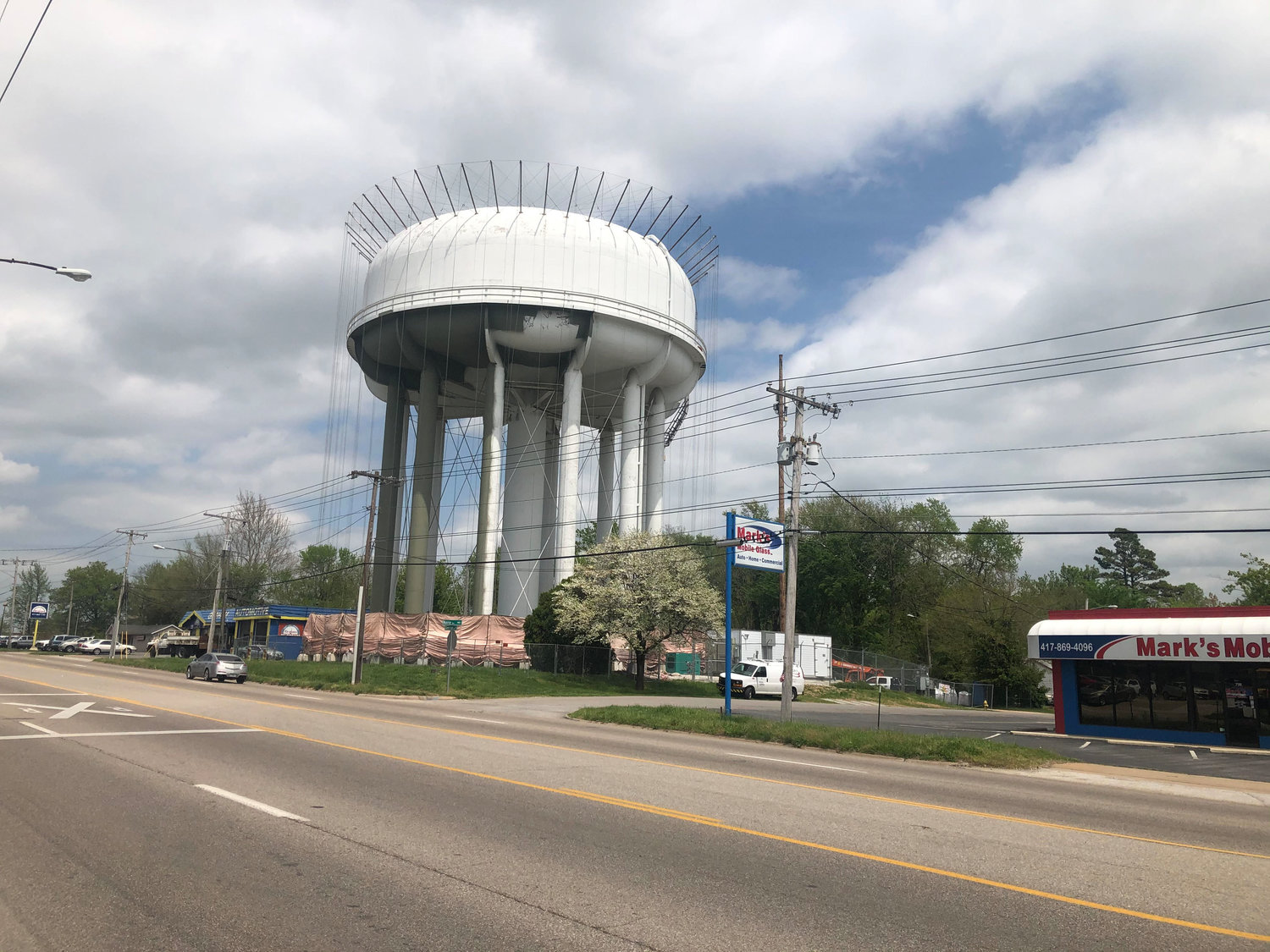 A metal apparatus on a Springfield water tower is being used in the repainting process.